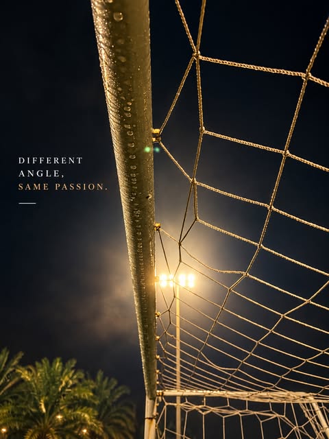 Looking up a goalpost at night